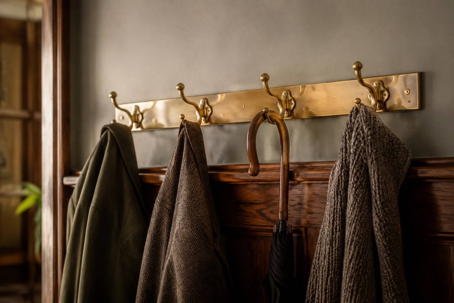 Brushed Brass Hook Rail in use